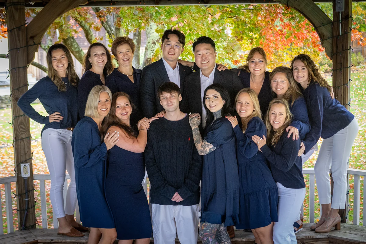 The Deep River Family Dental team together in an outdoor pavilion